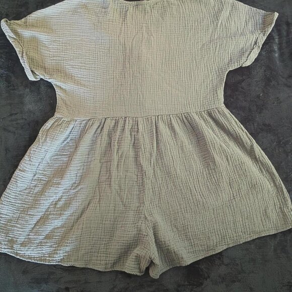 Large sage green romper featuring a v-neckline and five functional buttons down - Picture 2 of 2